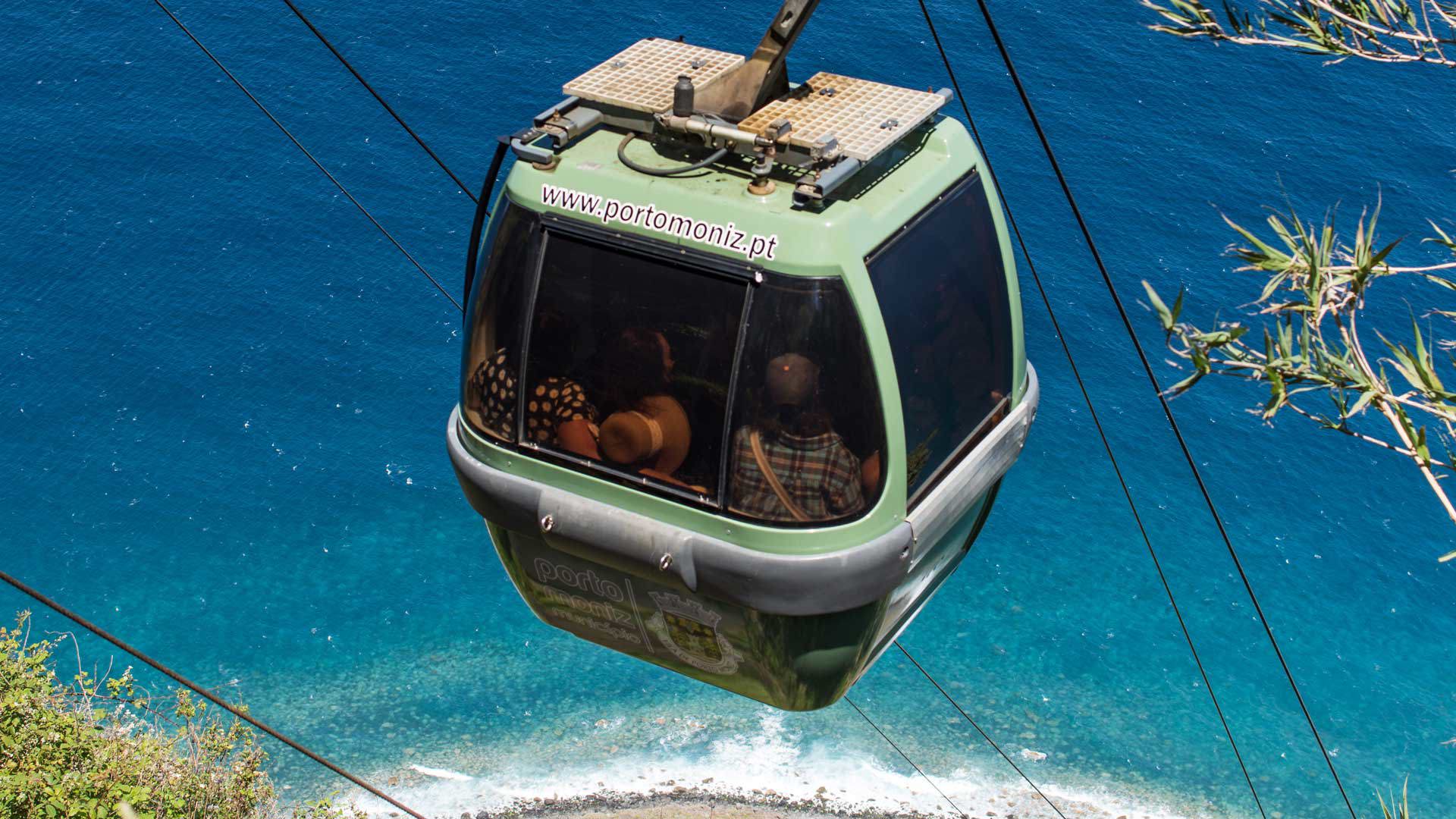 Cable car cabin overlooking the sea.