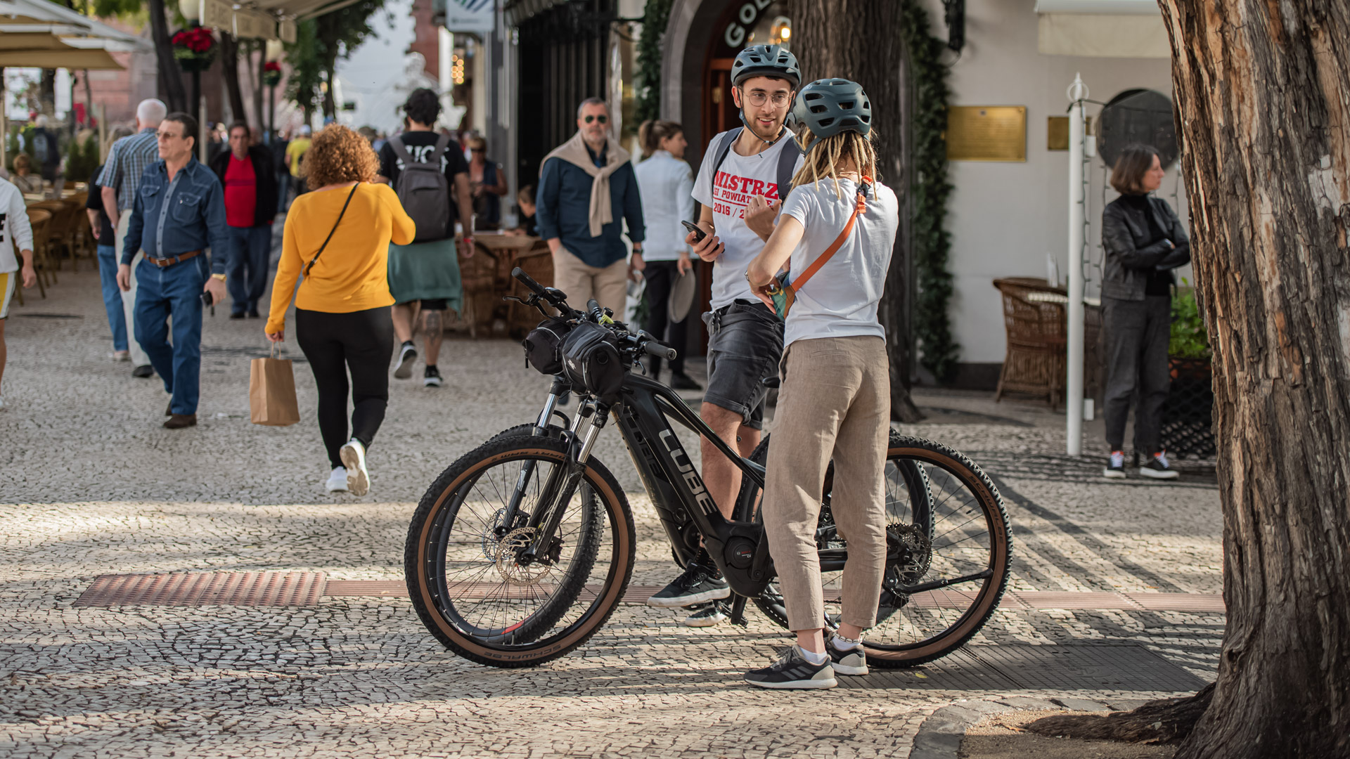 Couple on a bike ride outdoors.