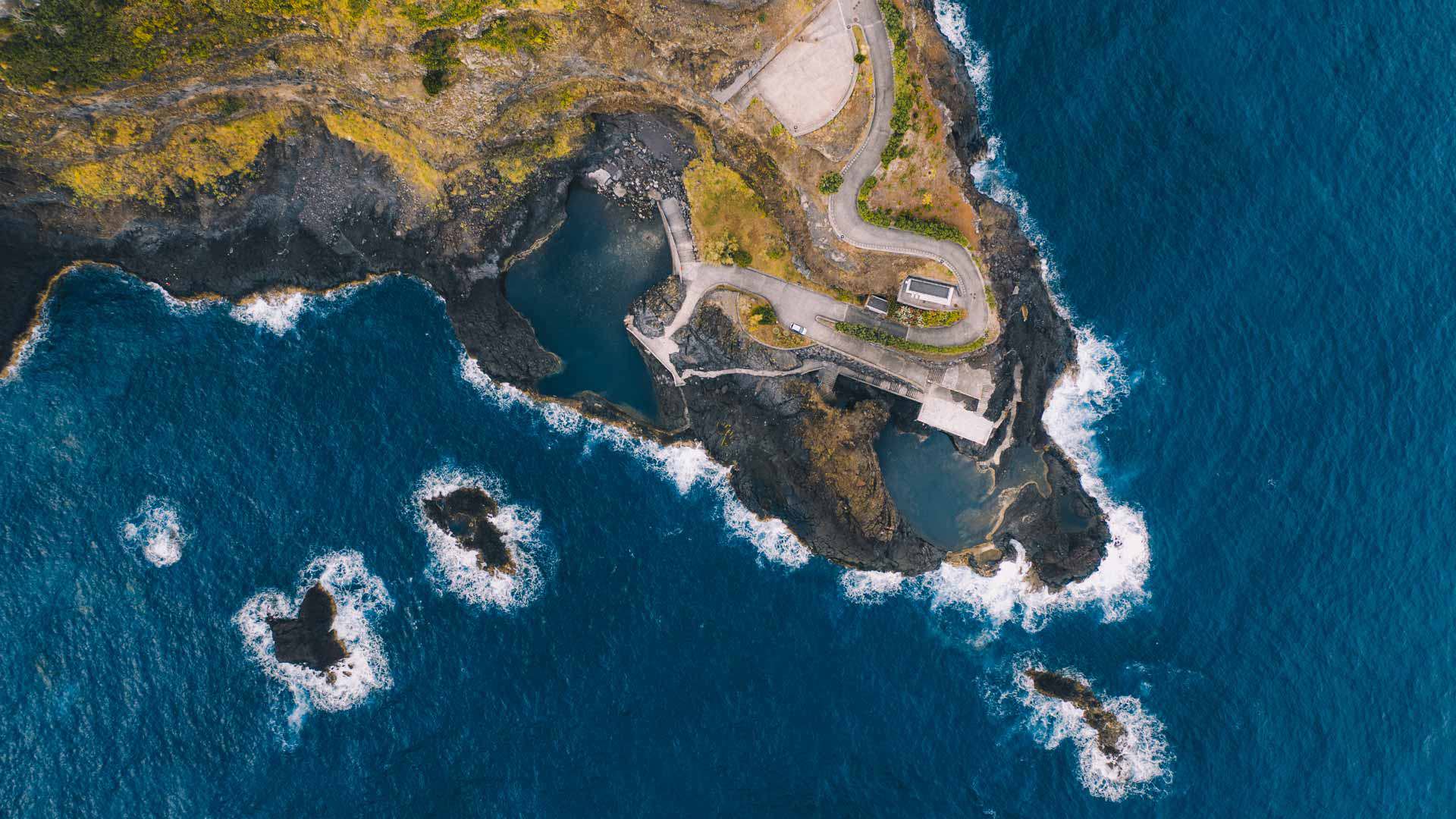 Drone image of natural pools with sea rocks in Madeira.