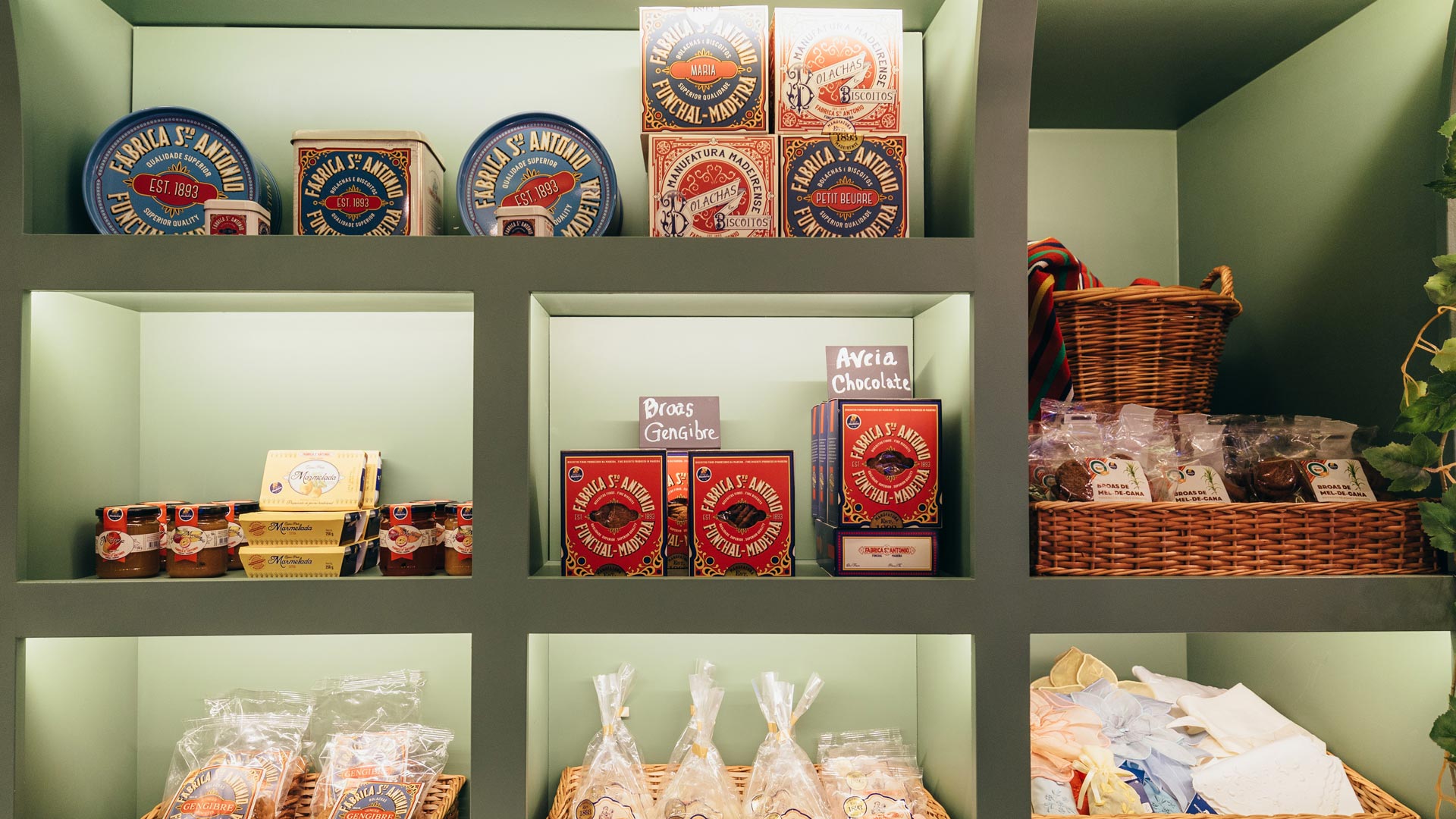 Shelf at the Madeira Tourism Office in Lisbon displaying Madeiran products.