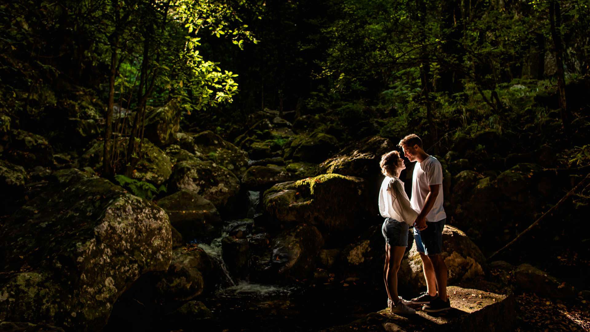 Couple walking in a forest.
