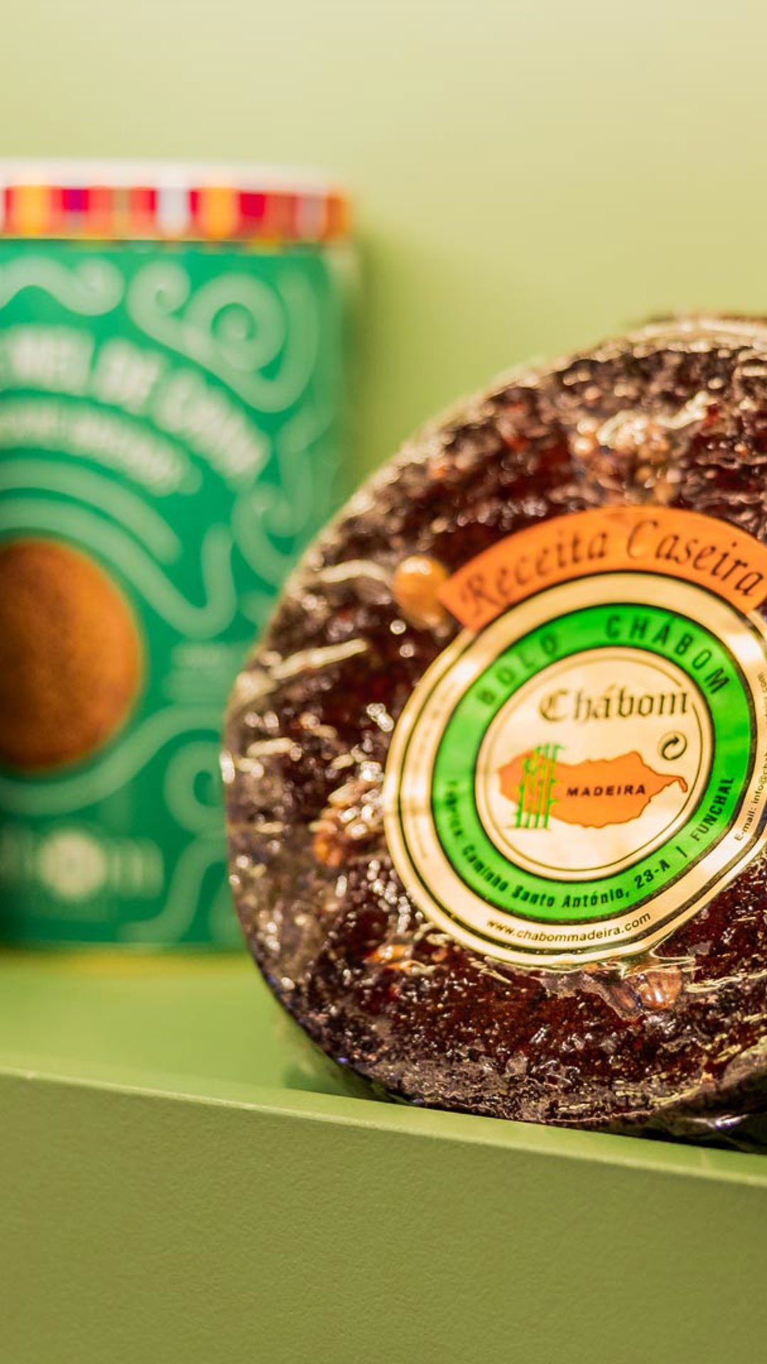 Shelves at the Madeira Tourism Office in Lisbon displaying broas and honey cake.