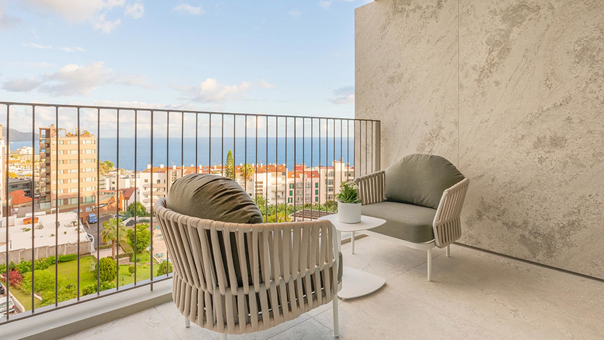 Two chairs on the balcony with sea views at The Editory Ocean Way Funchal on Madeira Island.