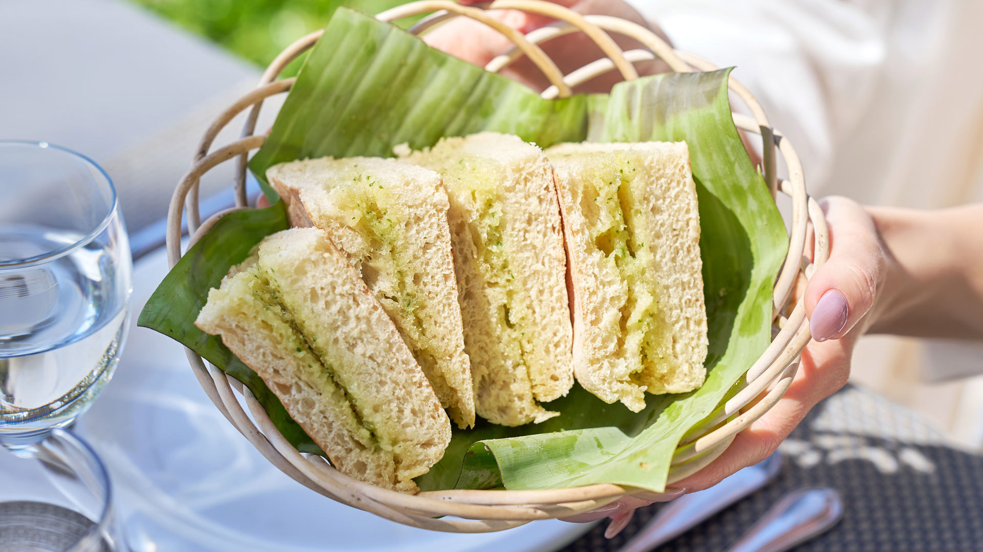 Bolo do caco with garlic butter served in a basket.