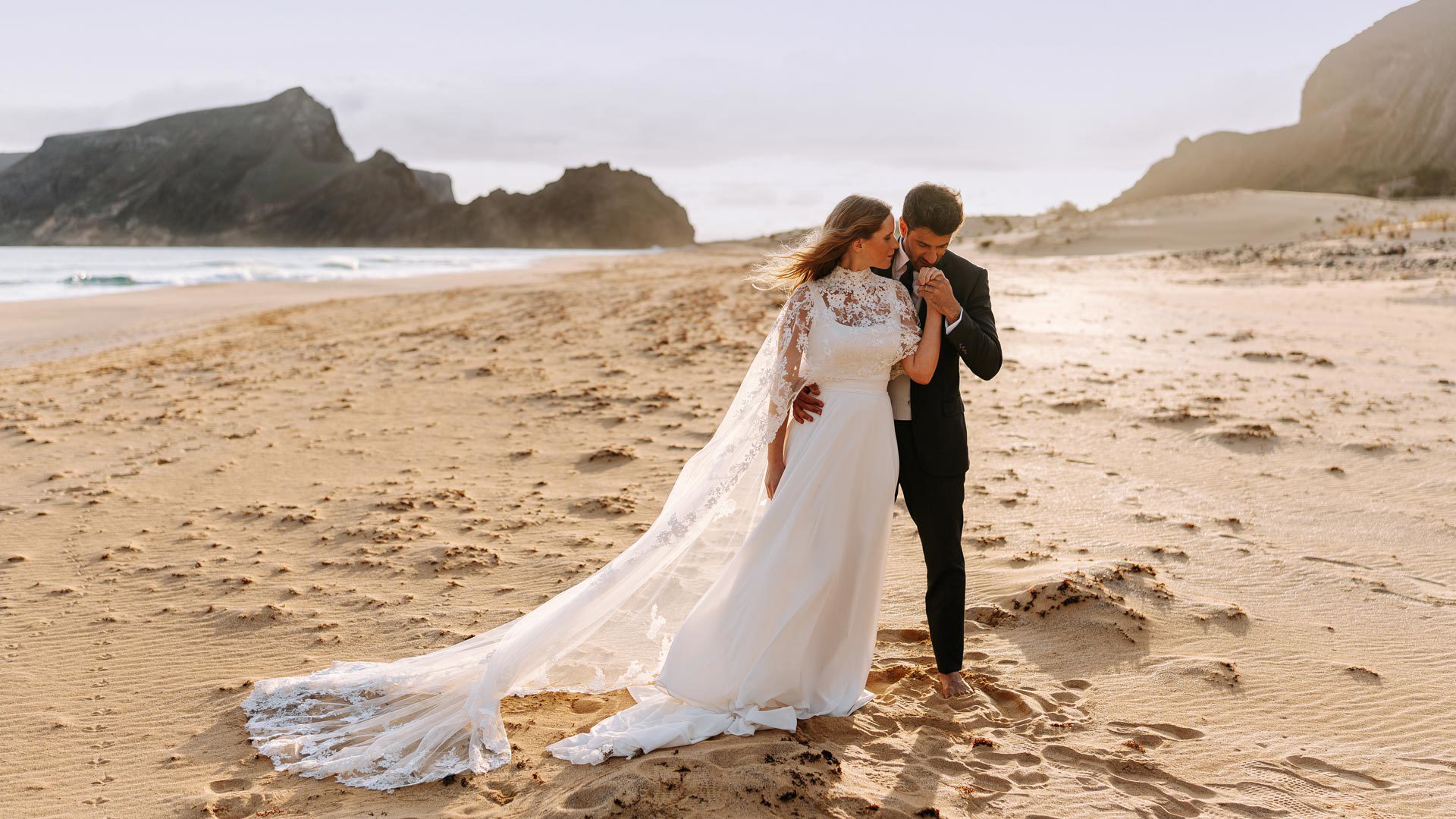 Couple in wedding attire on Porto Santo beach.