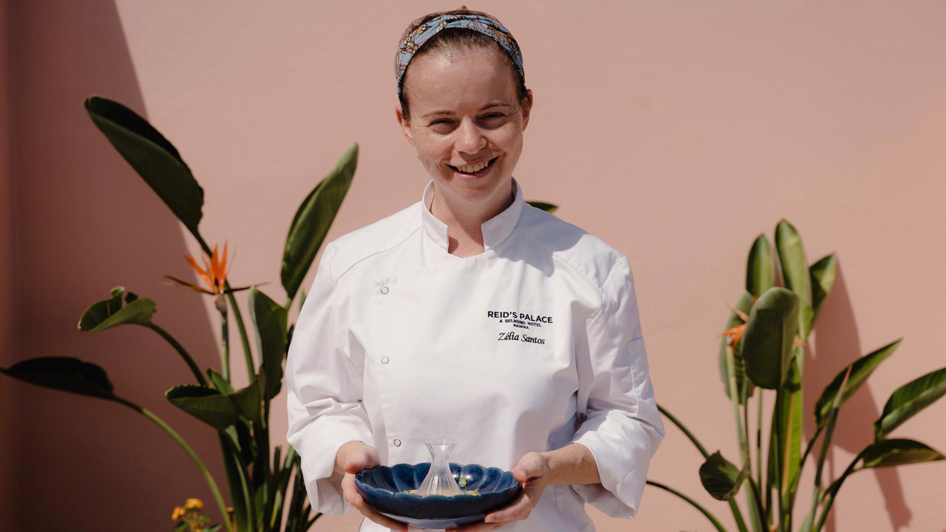 Woman holding a plate at Brisa do Mar restaurant at Reid’s Palace on Madeira Island.