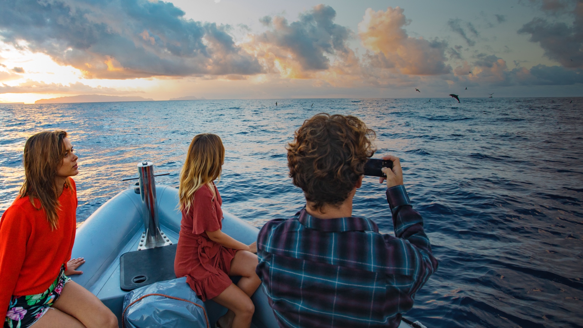 Tourists in a boat taking pictures