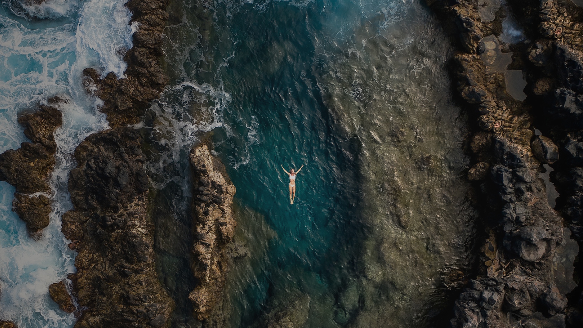 Person floating in the sea