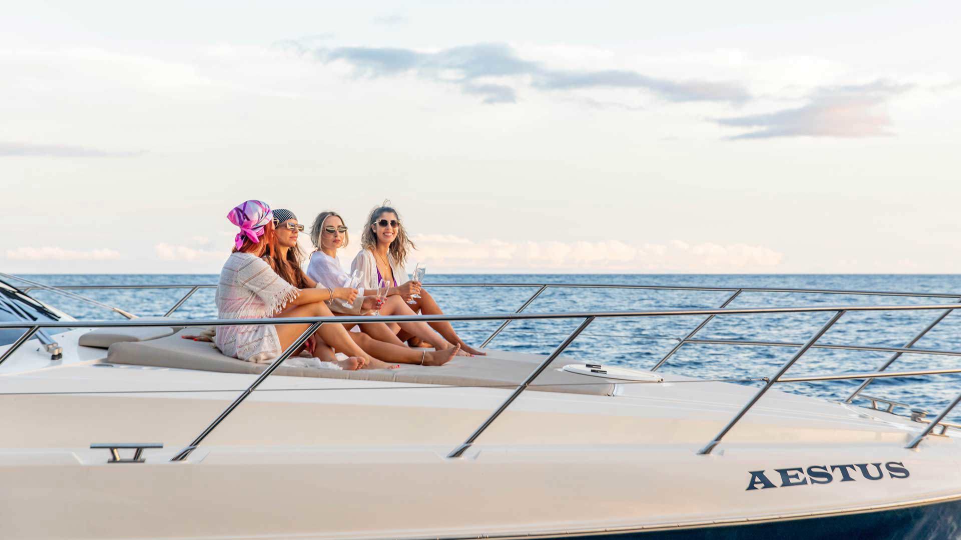 Women aboard Aestus Private Charter on a cruise in the sea of Madeira.