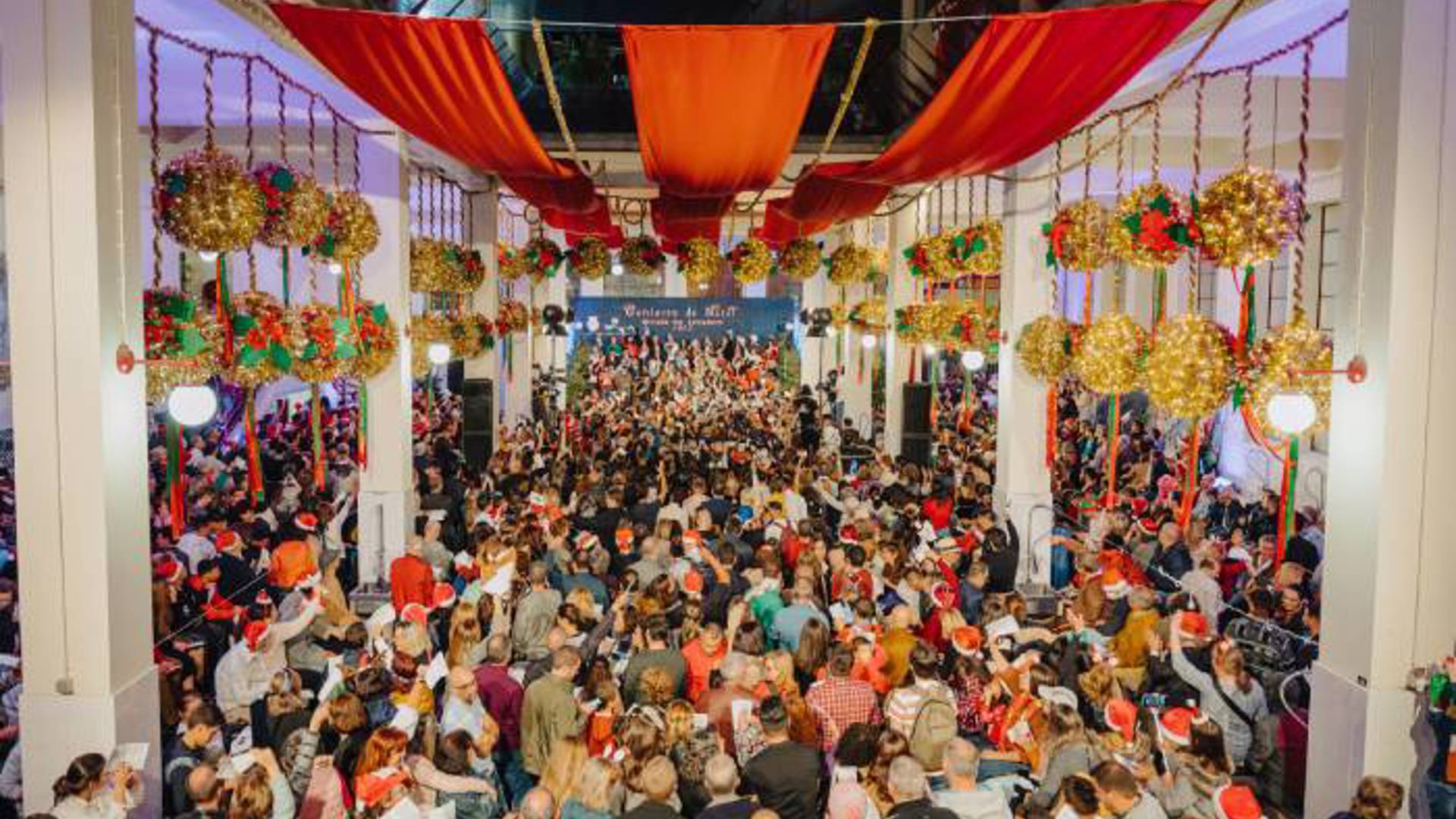 People attending the Night of the Market at Mercado dos Lavradores, Funchal, Madeira, during the celebration.