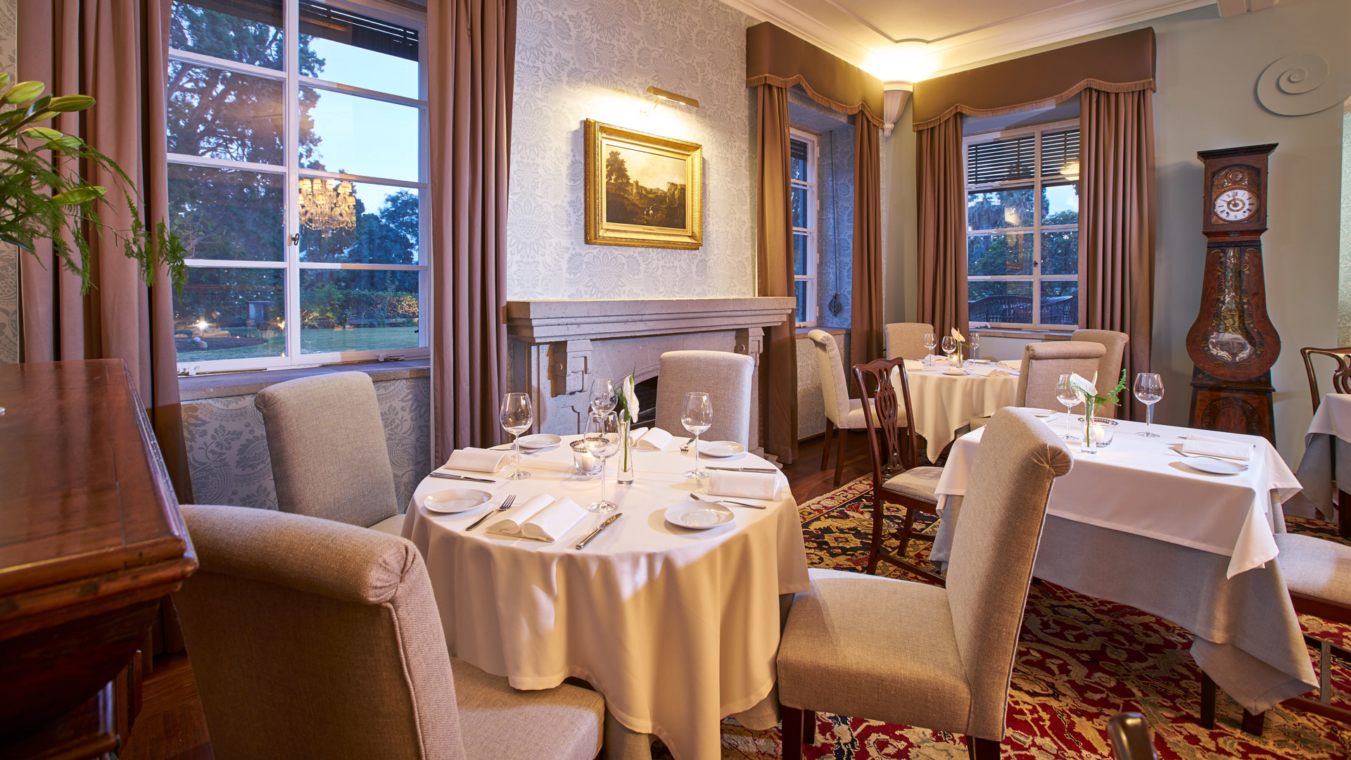 Round table surrounded by chairs.