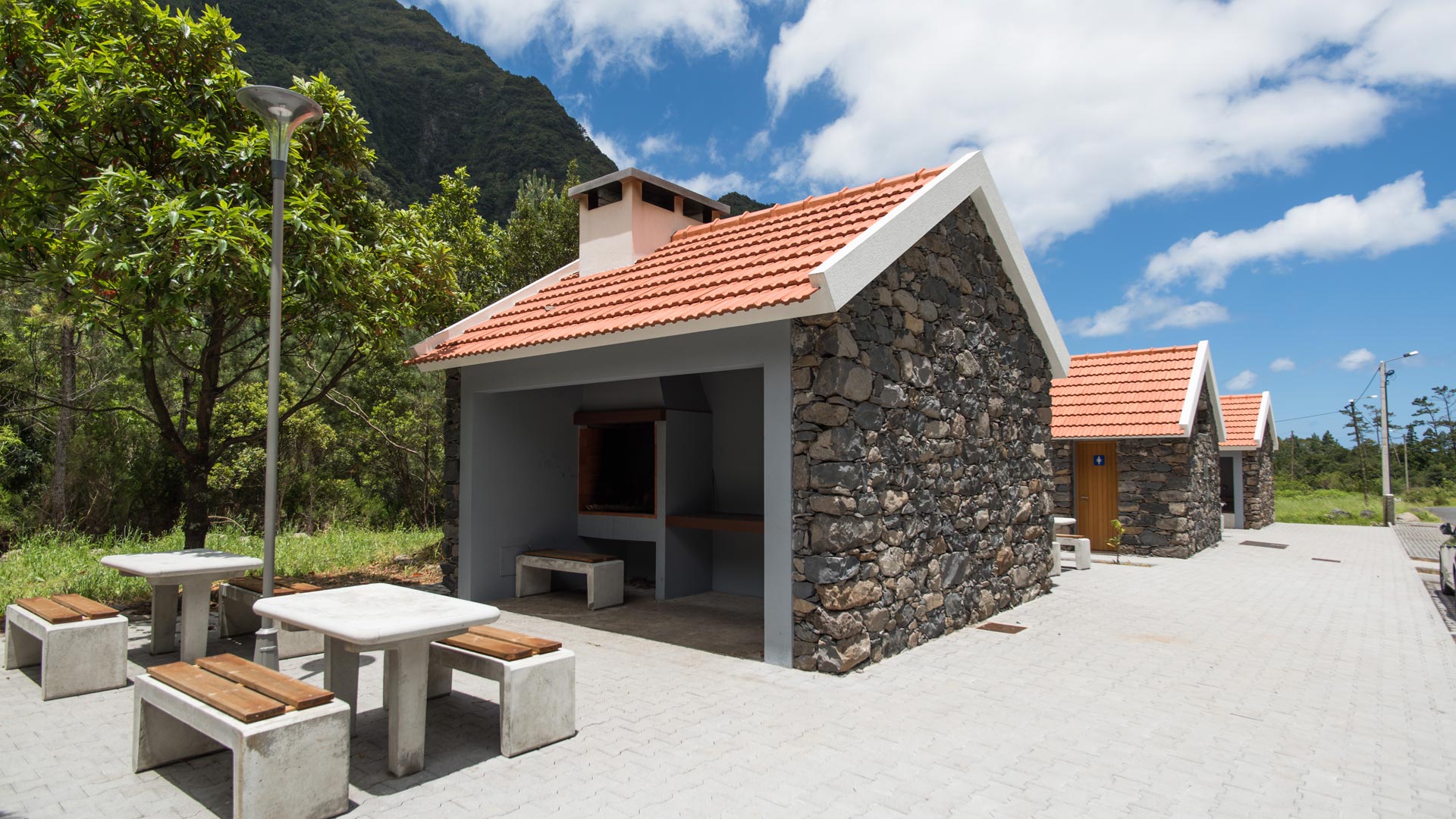 Barbecue house with bench and table for dining.